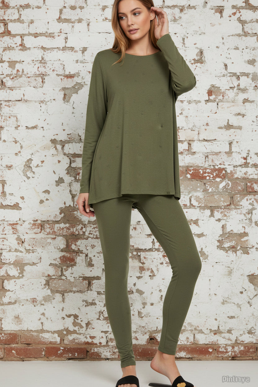 Woman wearing a green outfit with a blurred background